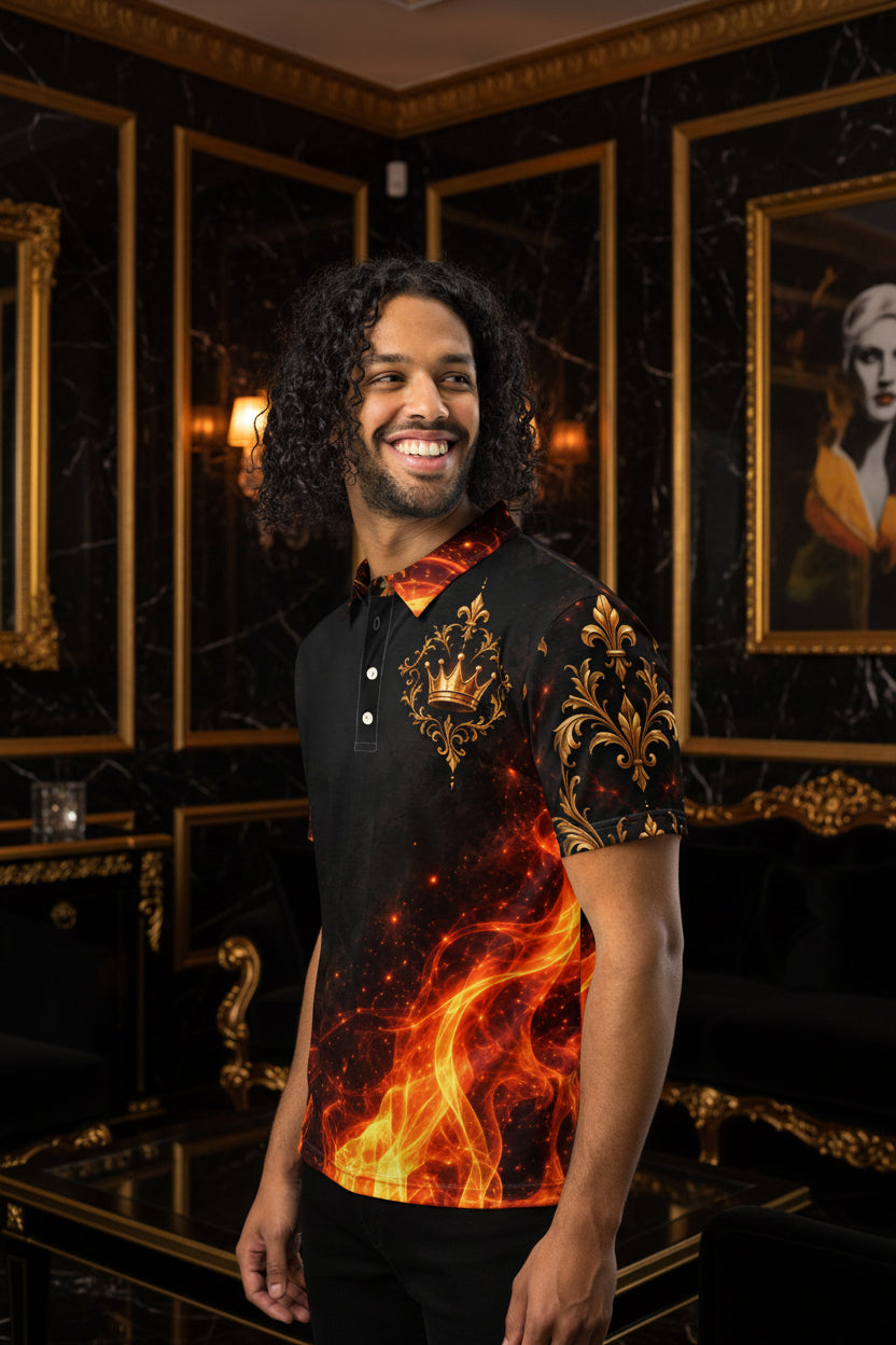 A man wearing a short-sleeve polo shirt with a black base and a fiery red, orange, and gold flame-and-crown graphic print, shown against a plain white background.
