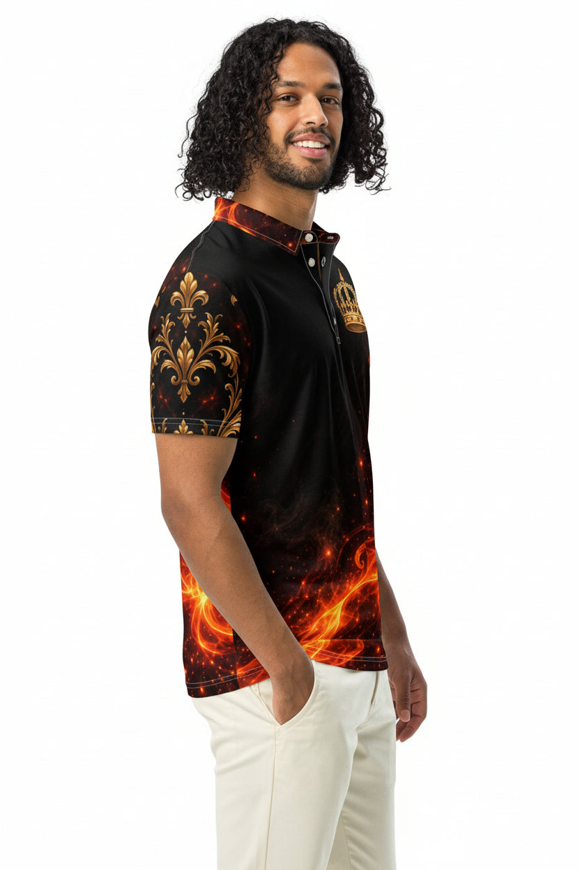 A man wearing a black short-sleeve half-zip polo shirt with a fiery orange and gold flame pattern, paired with off-white pants, set against a plain white background.